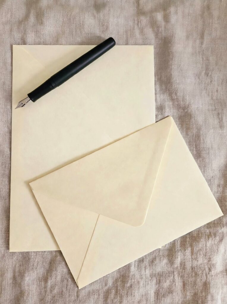 Hnadwritten letter with The Letter Parlour envelopes and stationery